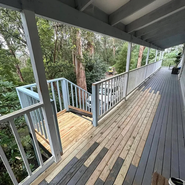 Roofed alfresco deck with a balustrade and a treed outlook