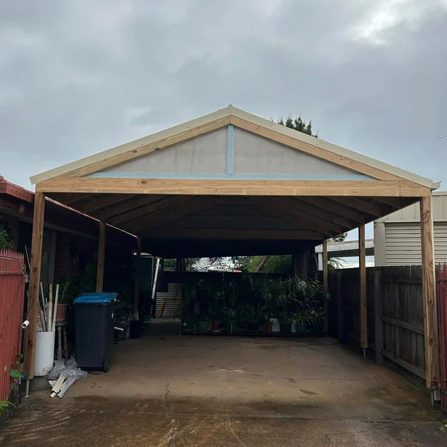 Gable roofed timber carport over a driveway