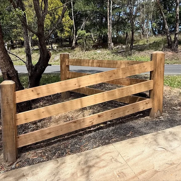 Post and rail timber fencing across a rural frontage