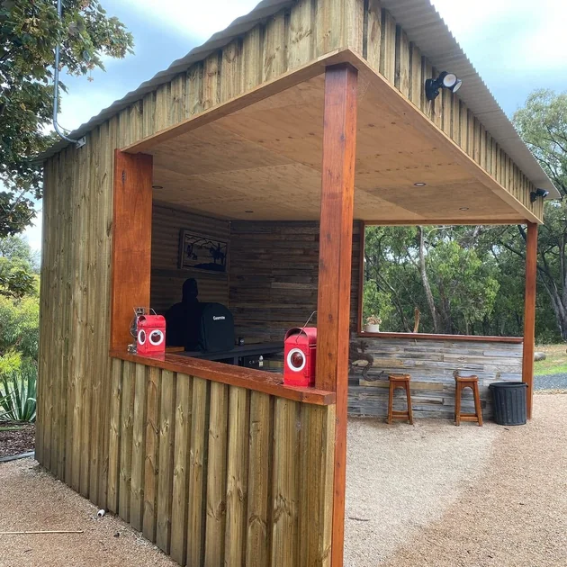Custom timber outdoor bar with a corrugated iron roof