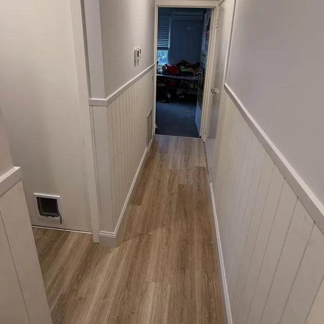 Hallway with wainscot panelling and new trims