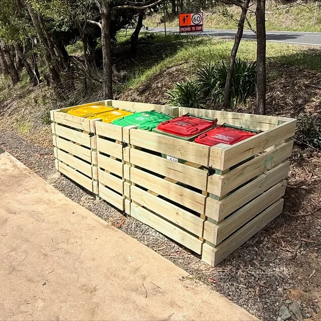 Custom timber bin enclosure built at the top of a driveway