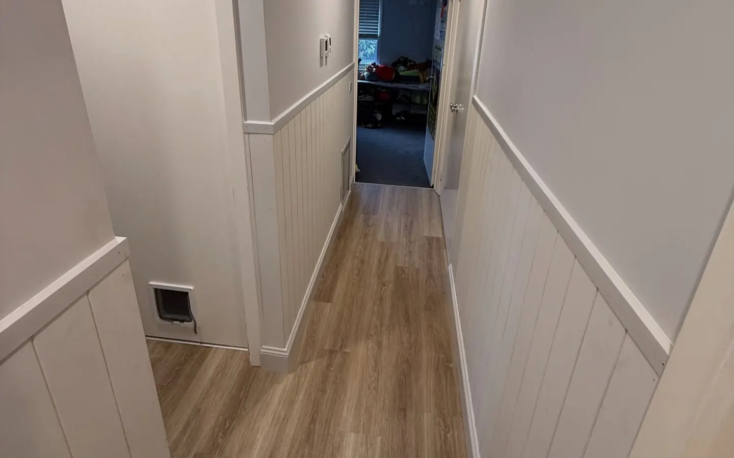 Hallway with wainscot panelling and new trims