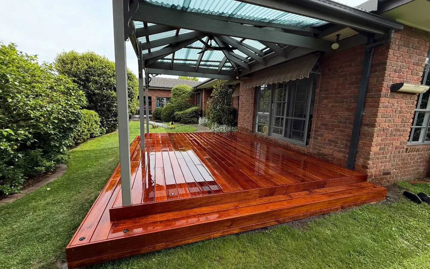 Hardwood deck under a glass verandah roof at a south east Melbourne home