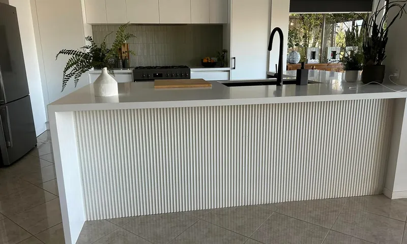 Renovated kitchen with a fluted island bench