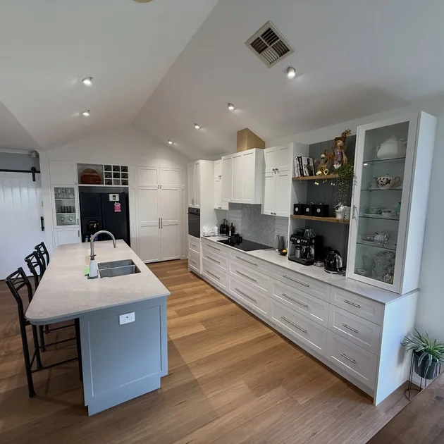Finished kitchen with an island bench and a barn door