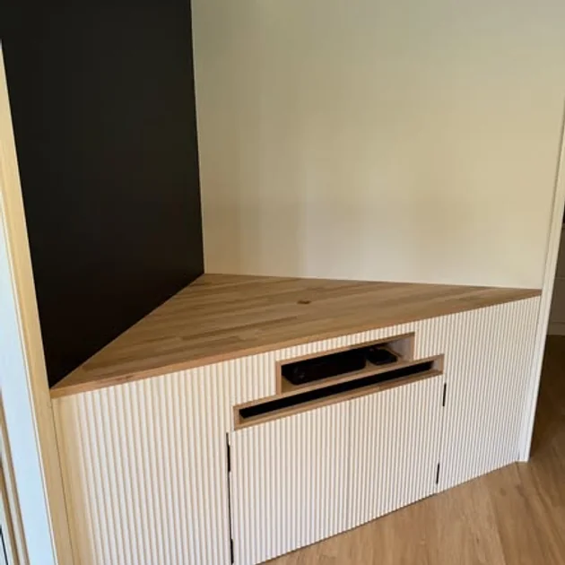 Built-in joinery with a fluted front and timber top