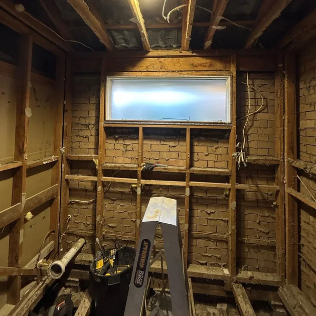 Room stripped back to the original frame and lath