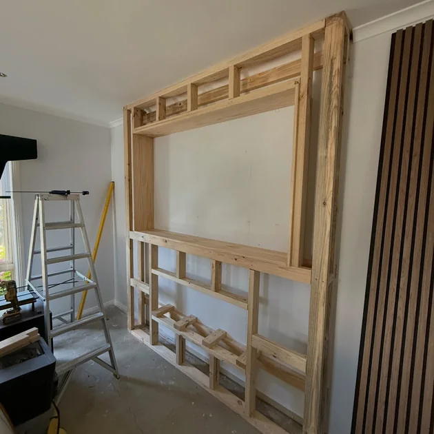 Timber wall frame partially erected on site