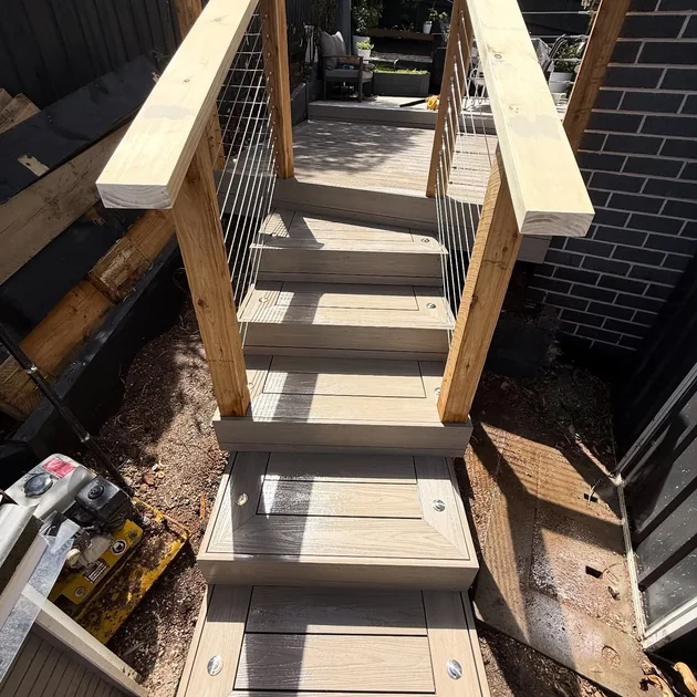 External timber stairs with a wire balustrade