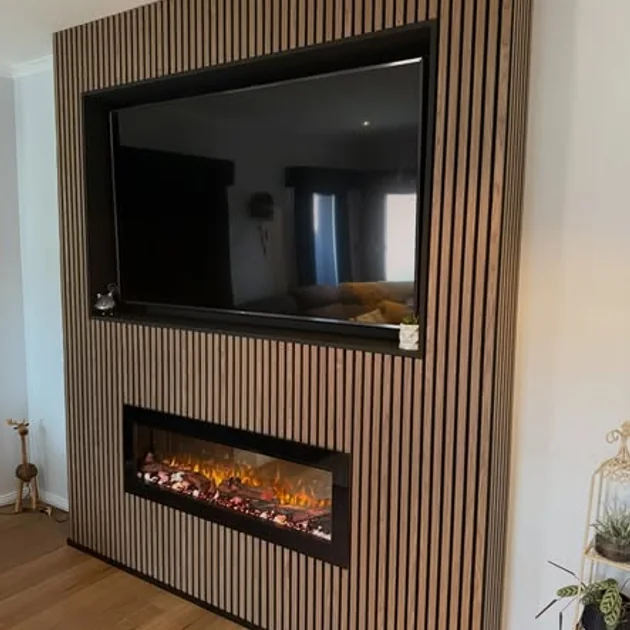 Fluted timber feature wall housing a television and fireplace