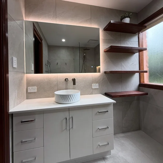 Renovated vanity with timber shelving and stone top